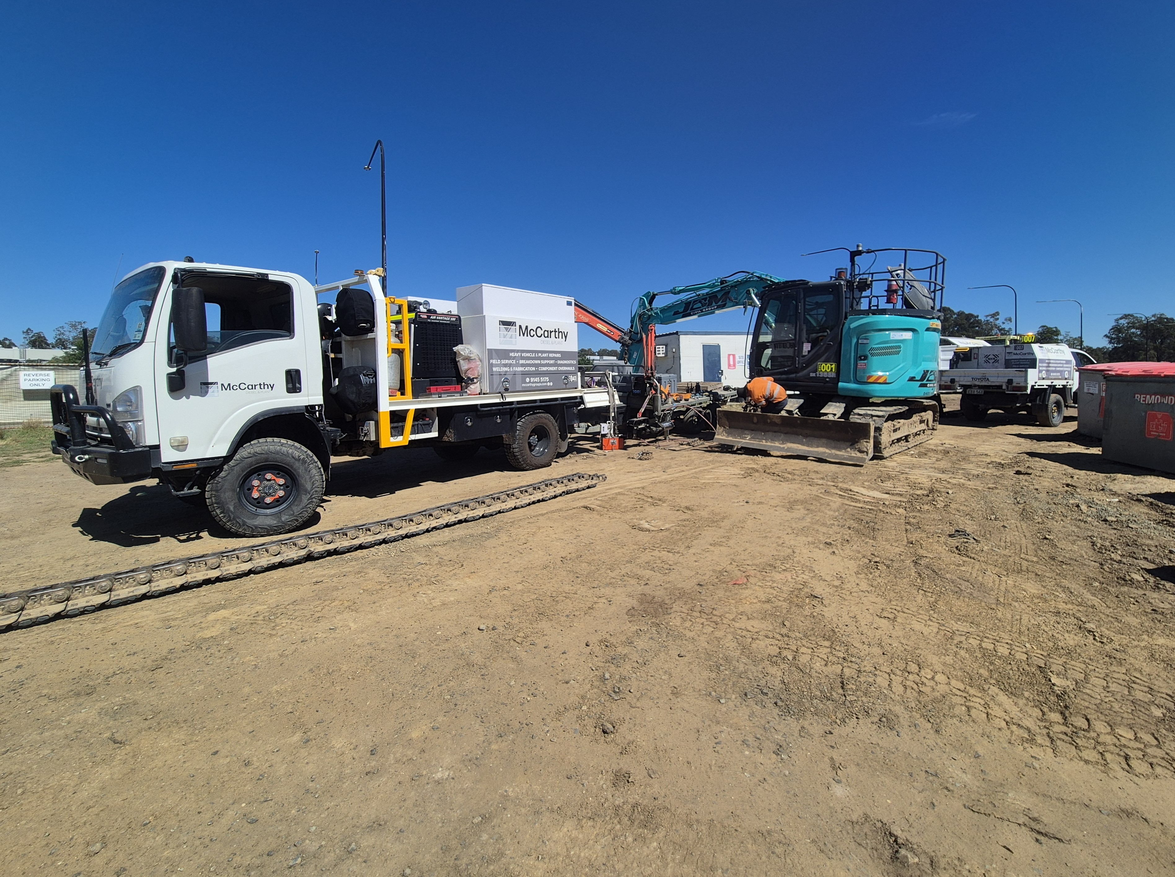 McCarthy field service vehicles supporting an excavator onsite